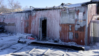 A brick building is covered in icicles after a fire damaged it.