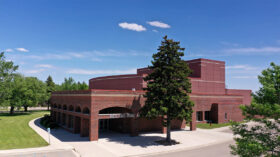 Photograph of a red brick building with the words 